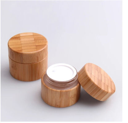 Tarro cosmético del envase de bambú natural de madera de la botella redonda que empaqueta el vidrio interno