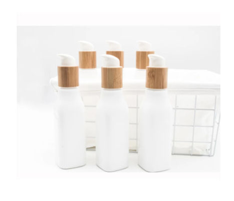 Envase cosmético liso de la loción de la botella de cristal de OPL y tarro poner crema con la tapa de madera