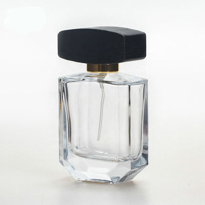 Botella de perfume de cristal vacía con el casquillo negro de madera del collarwith del espray del casquillo y de la bomba