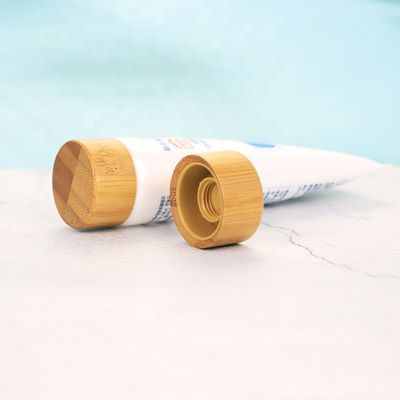 Casquillo de bambú cosmético de encargo vendedor caliente de la tapa de bambú del tapón de tuerca ISO2000 para el tubo