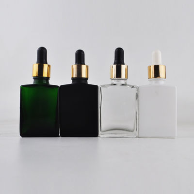 Botella de cristal cosmética del dropper 30ml del rectángulo con el casquillo de bambú para el aceite esencial