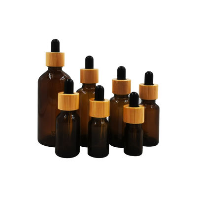 18/410 botella de aceite esencial de cristal vacía con cuidado personal del casquillo de bambú del dropper